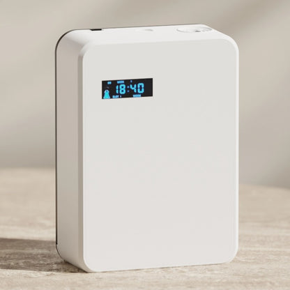 White electronic device with digital display on a neutral background