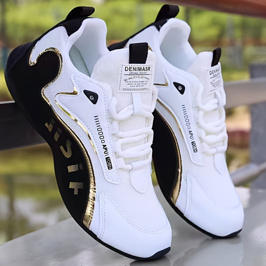 White sneakers with black and gold accents on a blurred natural background