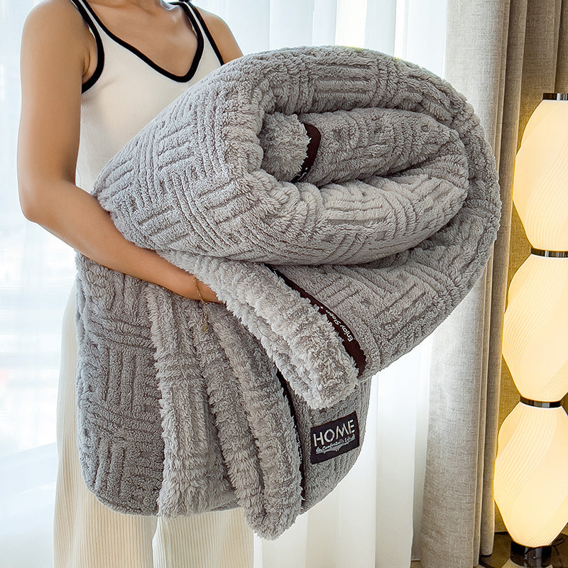 Gray plush velvet winter blanket with textured stripe pattern, red inner trim, and sherpa edge
