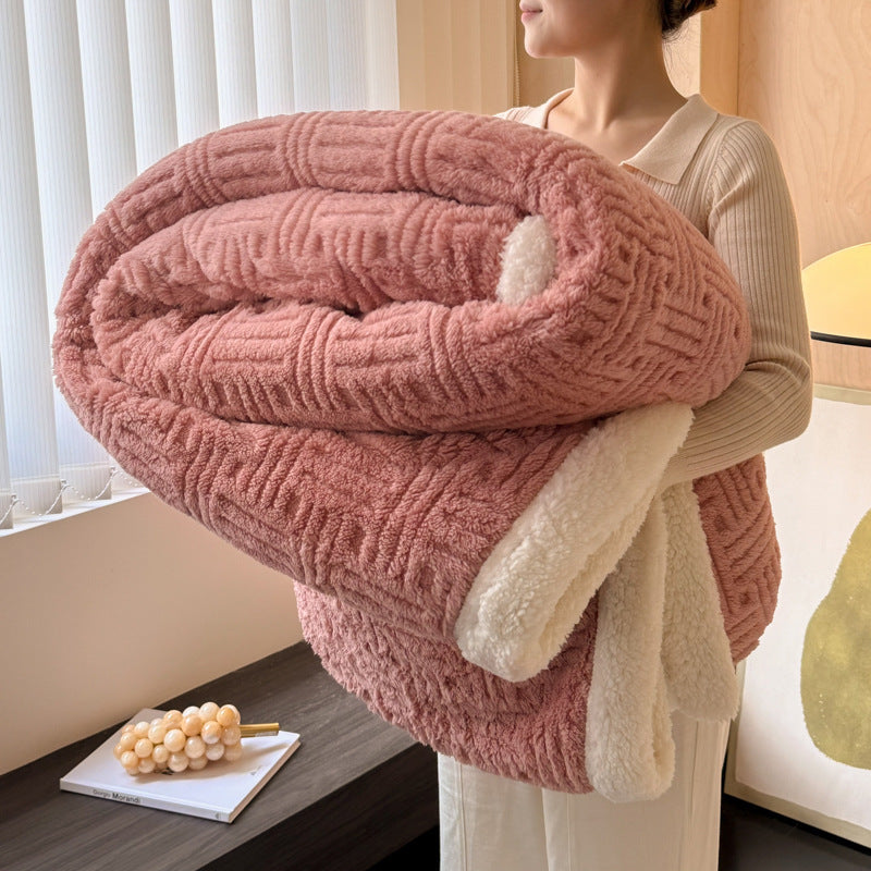 Dusty rose plush velvet blanket with textured stripes and soft white sherpa trim, folded