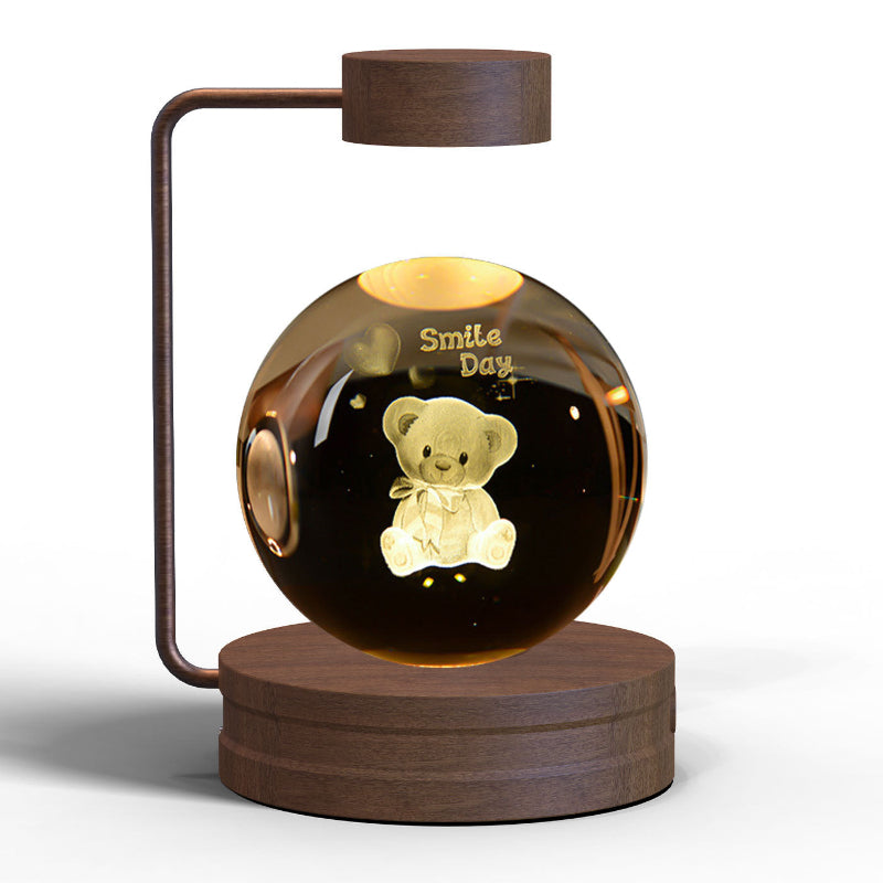 Glowing LED crystal ball night light with teddy bear graphic inside wooden base