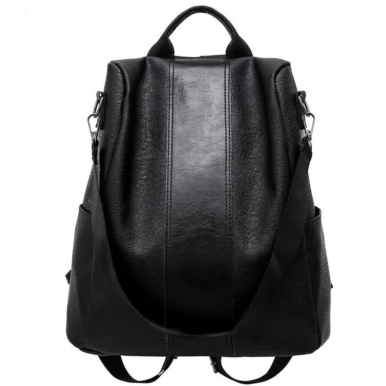 Black leather backpack on a white background