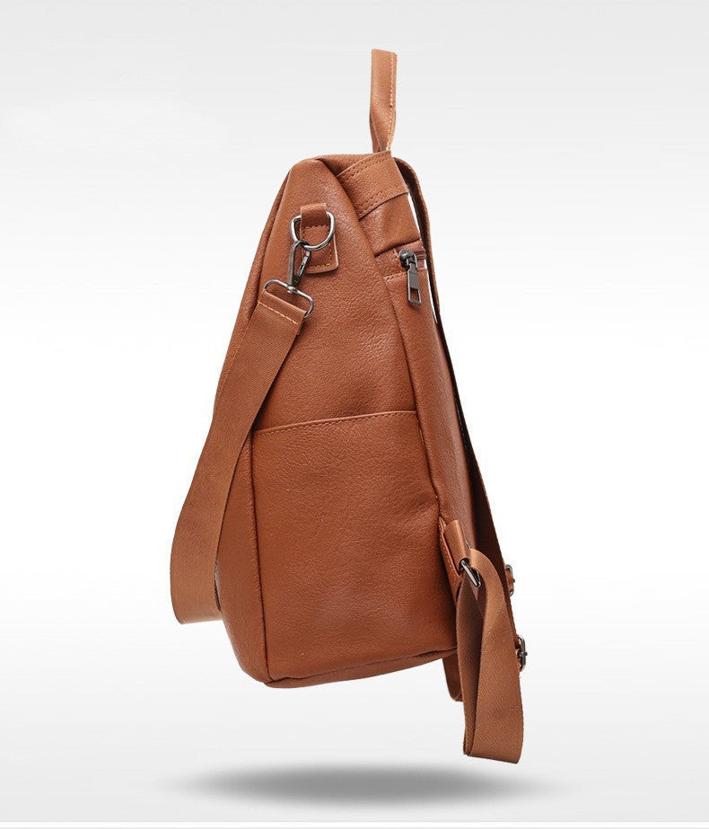 Brown leather backpack on a white background