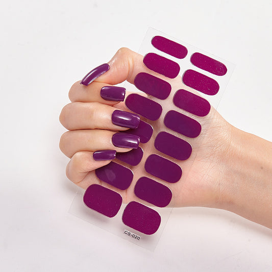 Purple nail polish samples on a hand with a white background