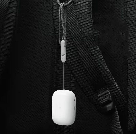 White A-5 earbud charging case attached to a hanging cord