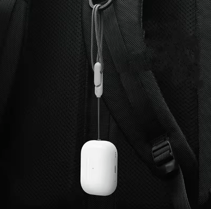 White A-5 earbud charging case attached to a hanging cord
