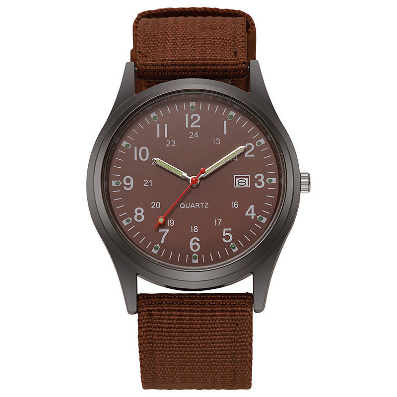 Quartz wristwatch with brown canvas strap and dark dial, date window at 3 o’clock.