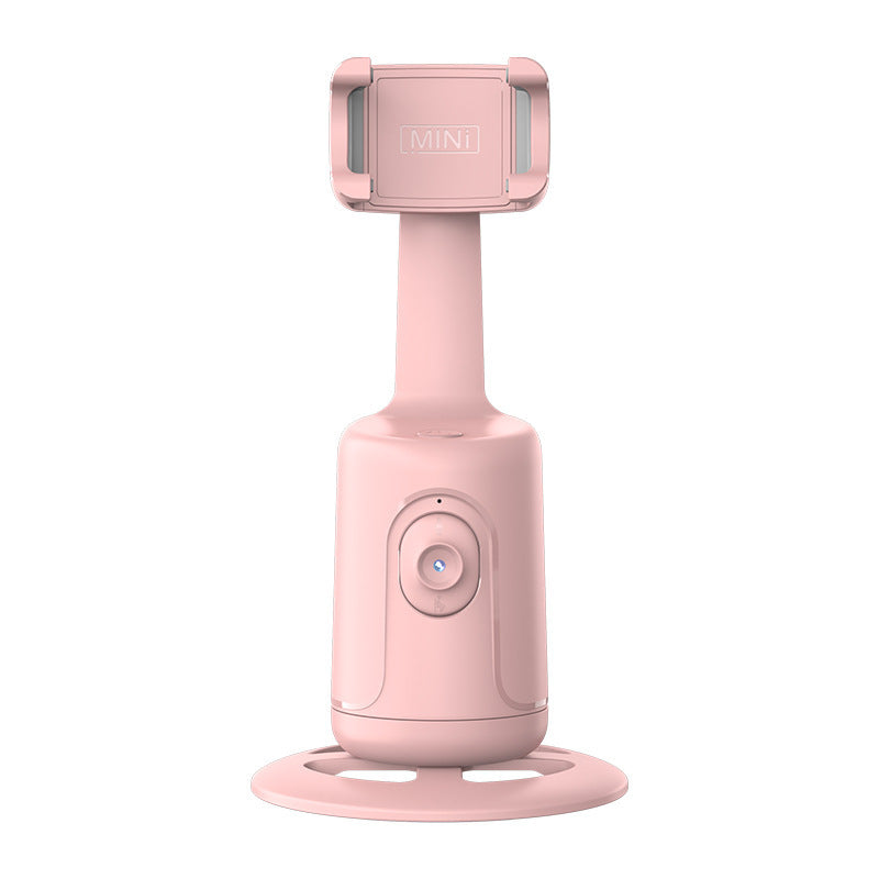 Pink handheld device with a stand on a white background