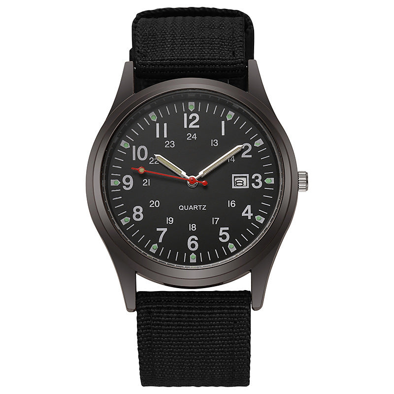 Quartz wristwatch with black canvas strap and dark dial, date window at 3 o’clock.
