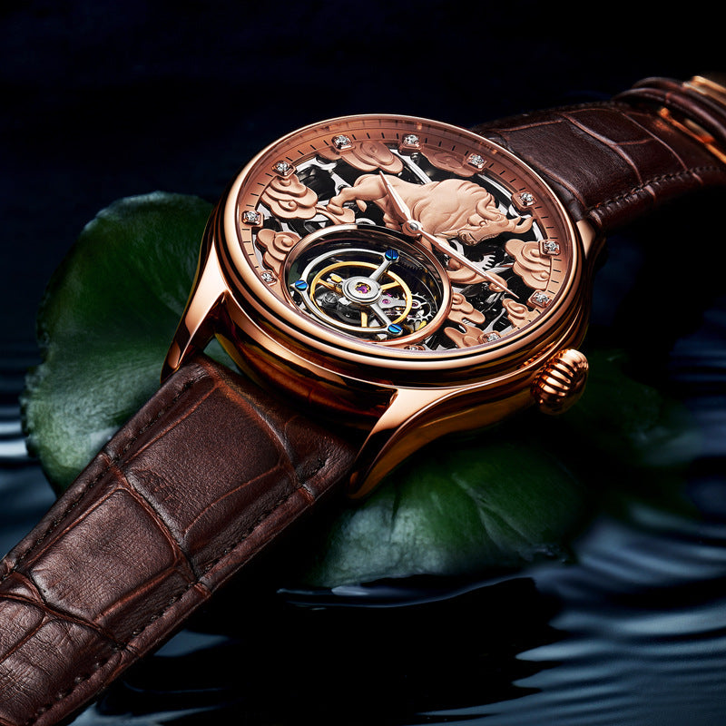 Rose-gold tone mechanical tourbillon wristwatch with brown leather strap, engraved dial