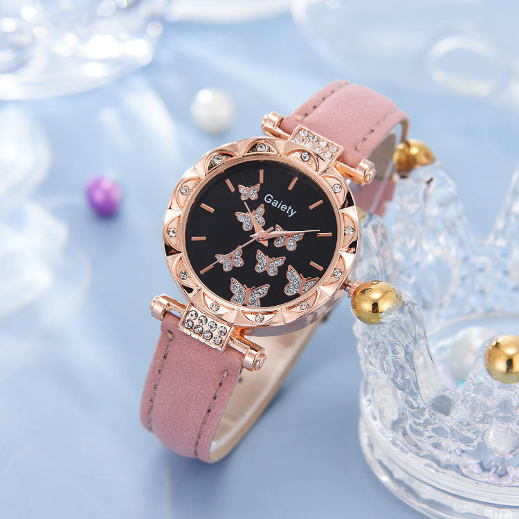 Women’s butterfly quartz watch with black dial and pink leather strap