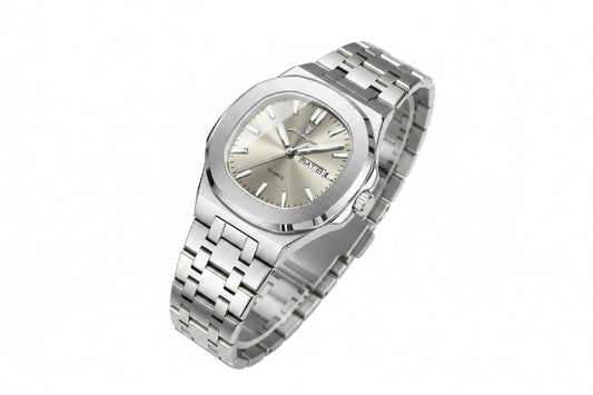 Silver watch with a metal bracelet on a beige surface, featuring a certificate of conformity.