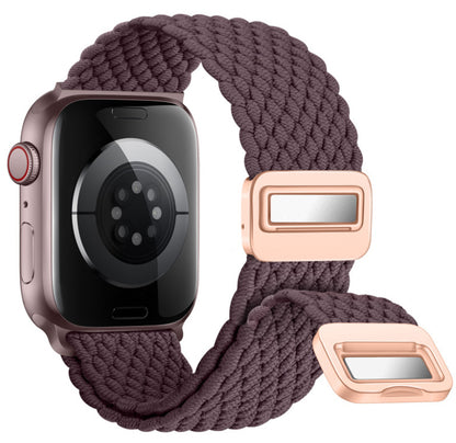Smartwatch with a braided purple strap and rose gold buckle on a white background