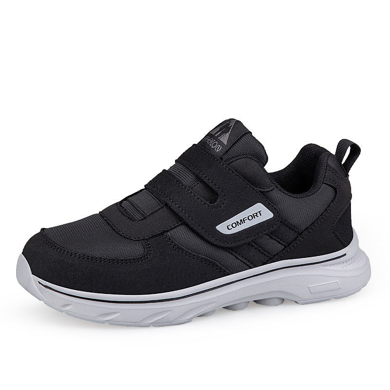 Black lightweight casual sneakers with hook-and-loop straps and white cushioned outsole