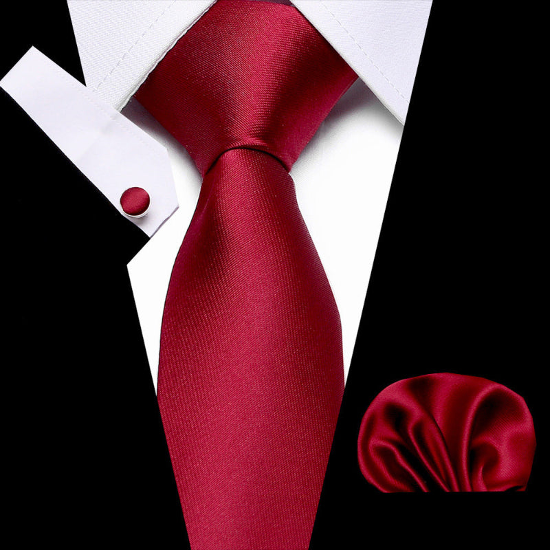 Business tie in red with smooth texture and matching pocket square.