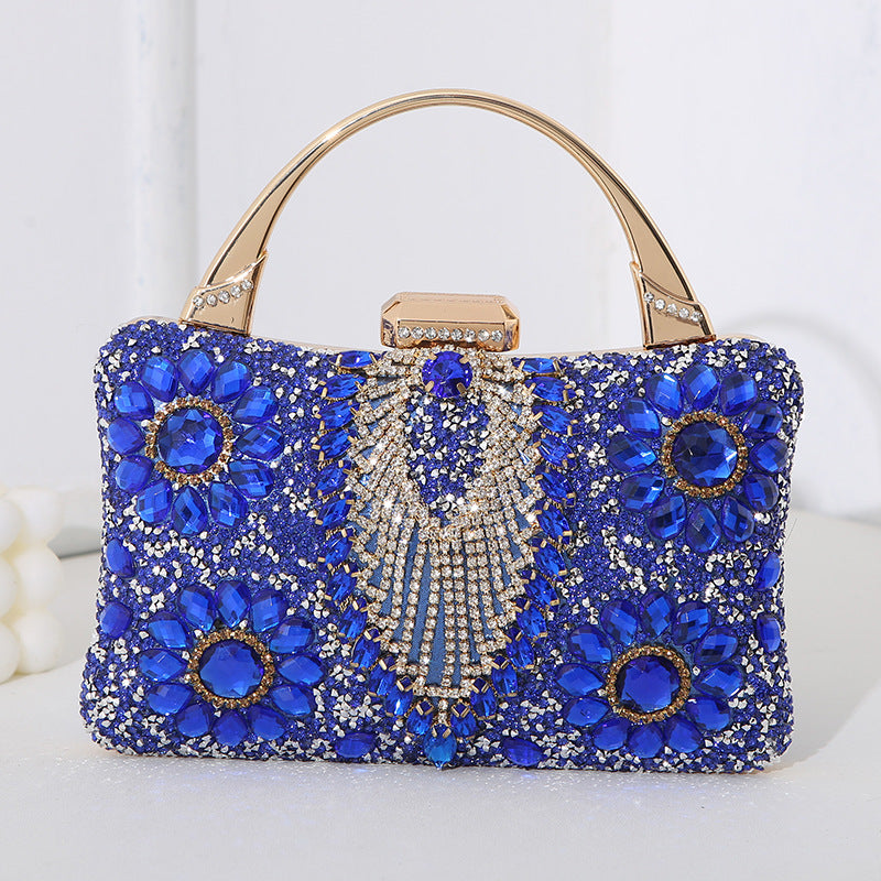 Handmade diamond clutch bag in royal blue with crystal floral accents and gold-tone handle