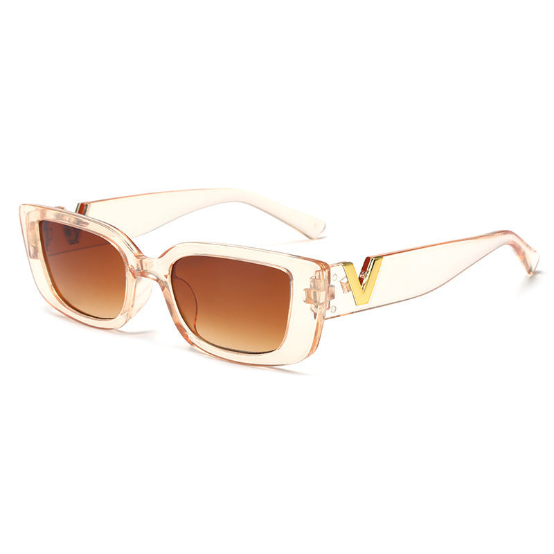 Square clear peach frame sunglasses with amber lenses and gold V temple detail