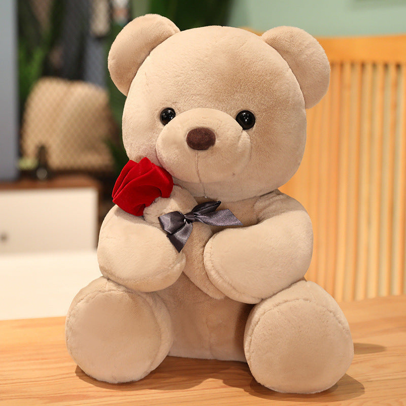 Beige teddy bear with a red rose and black bow YAXSO UAE ONLINE STORE