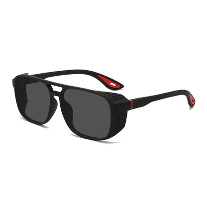 Black sunglasses with red accents on a white background