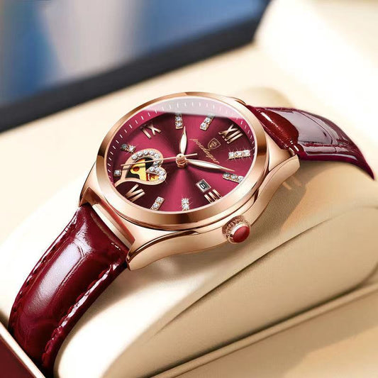 Women's automatic mechanical watch, angled view with burgundy dial, rose-gold case, red leather strap
