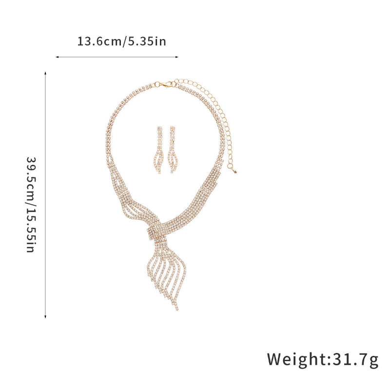 Gold-tone rhinestone necklace and dangling earrings on size chart