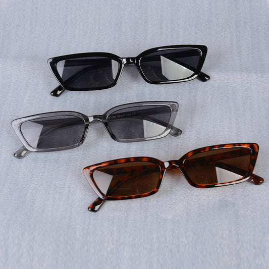 Three pairs of sunglasses with different frame colors on a light gray background