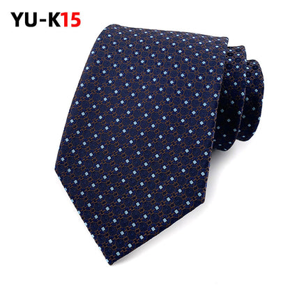Navy blue patterned tie on a white background with 'YU-K15' branding.