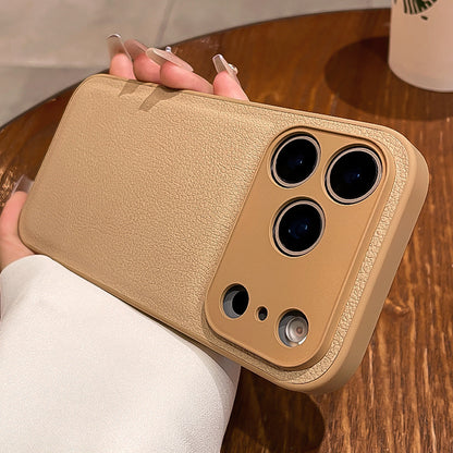 Beige phone case with camera lens on a wooden surface