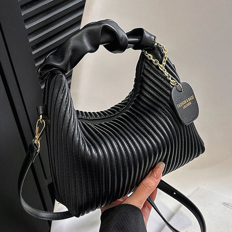 Black ribbed PU leather hobo crossbody bag with gold chain strap and heart charm tag