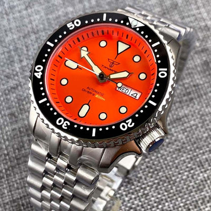 Watch with a red face and silver metal strap on a gray textured background