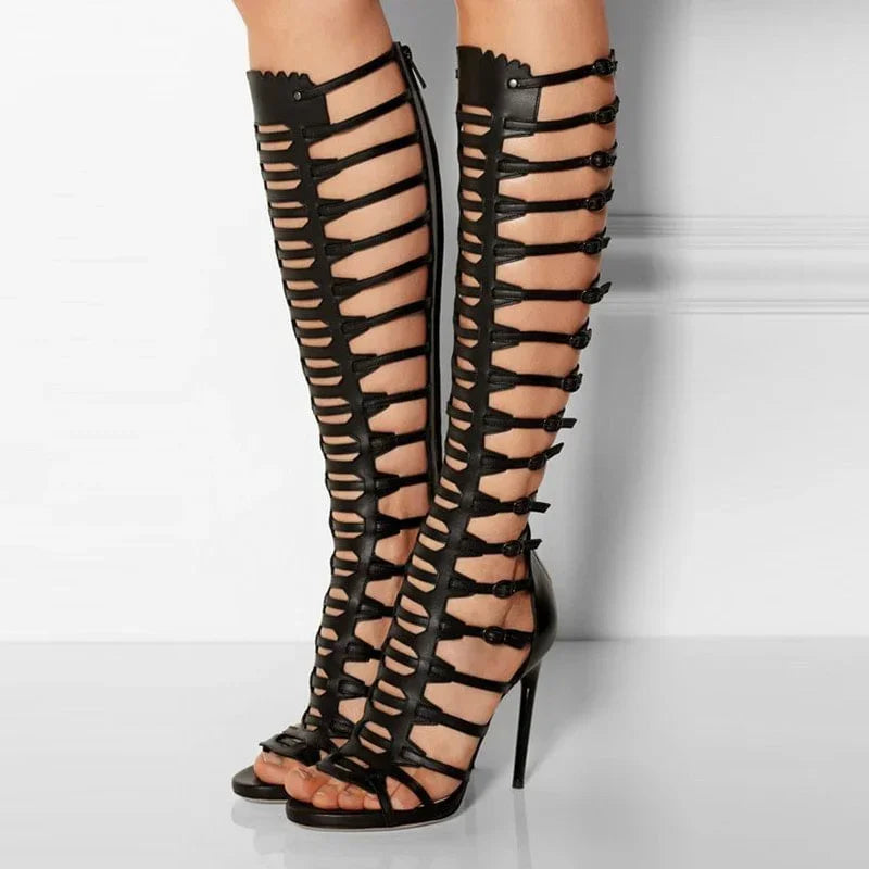 Black knee-high gladiator stiletto sandals with strappy lattice and open toe