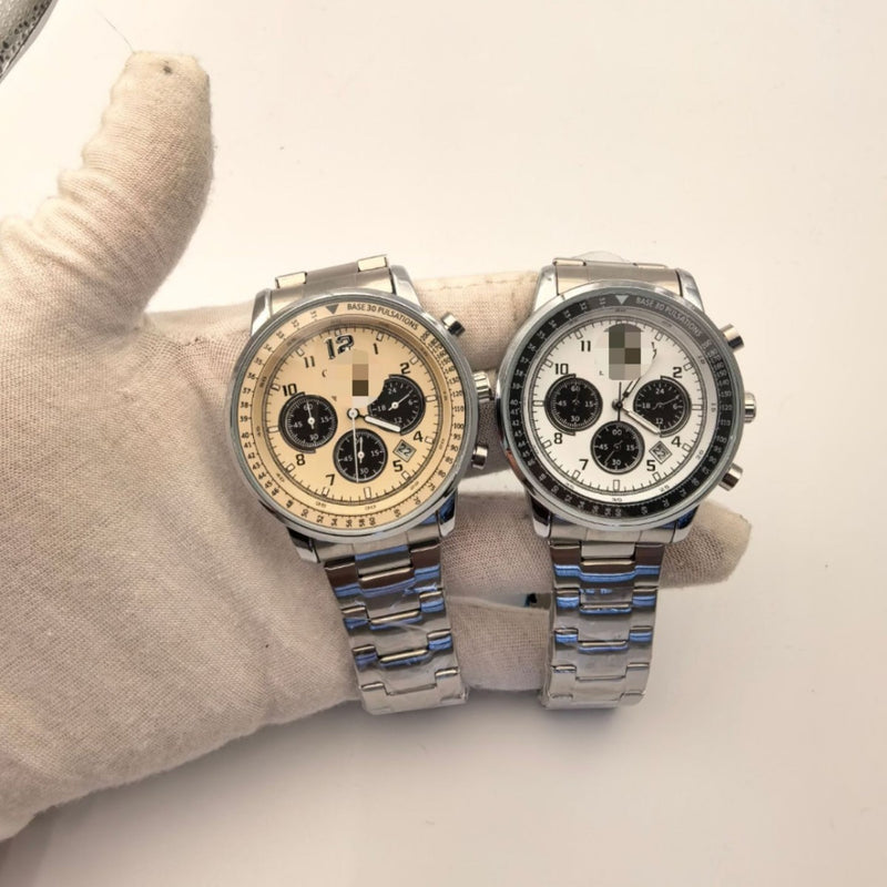 Two quartz watches with light dials and silver-tone link bracelets shown side by side