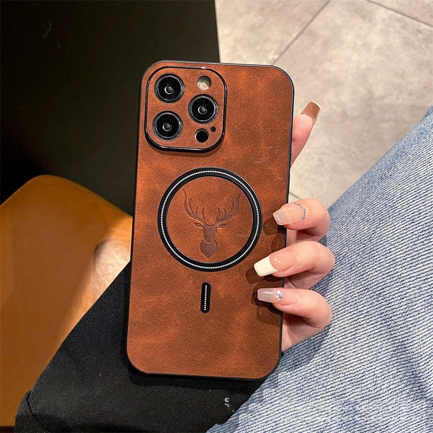 Brown phone case with deer emblem held by a person