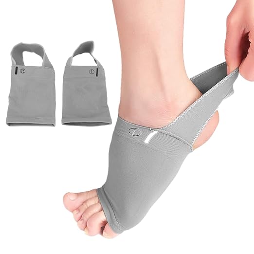 Grey arch support sleeves with cushioned strap, worn on foot