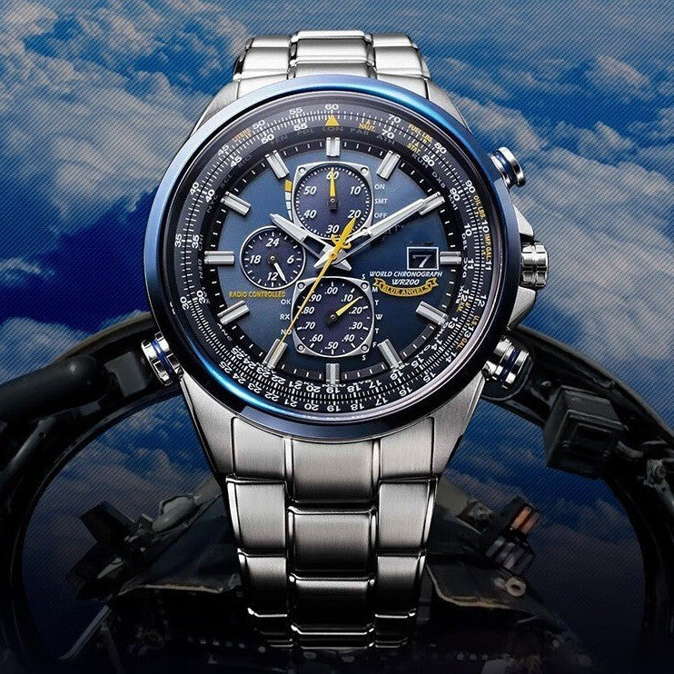 Silver wristwatch with a detailed face on a motorcycle against a blue sky background