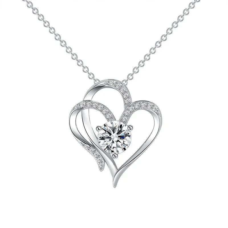 Silver-tone double heart pendant necklace with small pave hearts and center round stone
