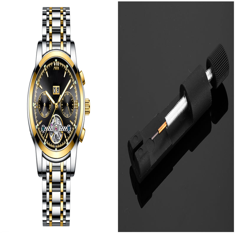 Luxury watch with black face and gold accents on a white background