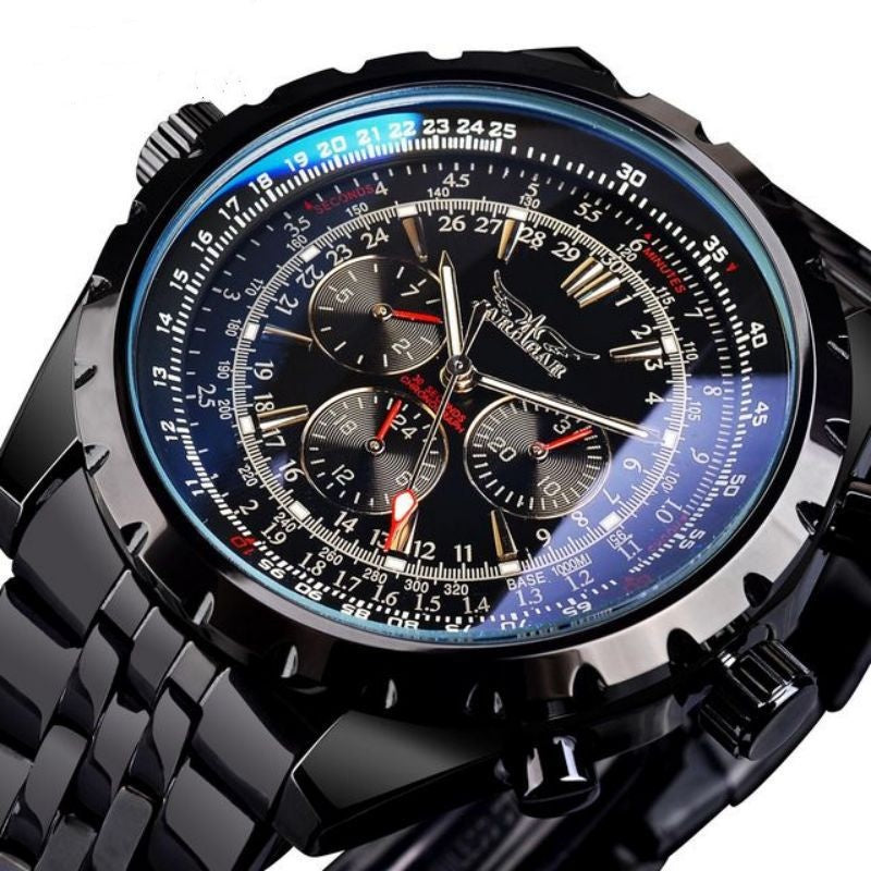 Black wristwatch with a detailed face on a white background