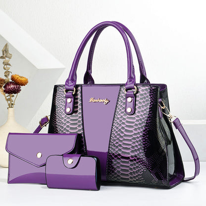 Purple shoulder tote bag with crossbody strap, scalloped texture, and matching wallet