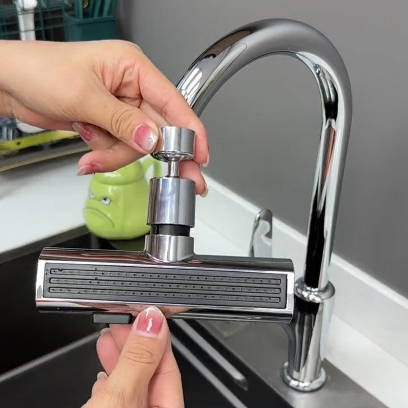 Person holding a kitchen faucet handle in front of a sink
