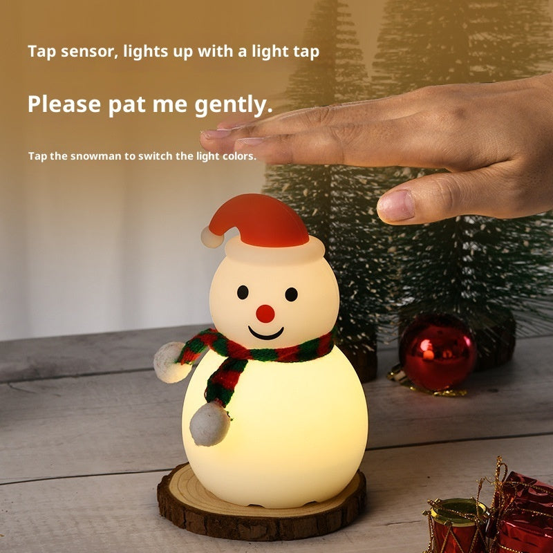 Snowman night light on wooden base with red hat and scarf; tap sensor with hand