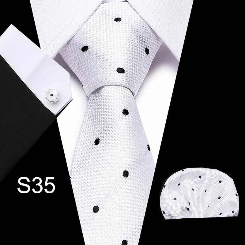 Men's business tie in light gray/white with small black dot pattern