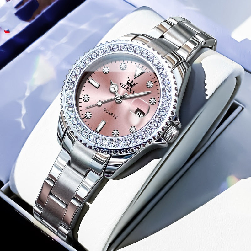 Quartz wristwatch with pale dial, crystal bezel, and silver metal link bracelet