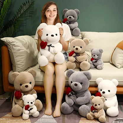 Woman holding a large white teddy bear with smaller teddy bears. YAXSO UAE ONLINE STORE