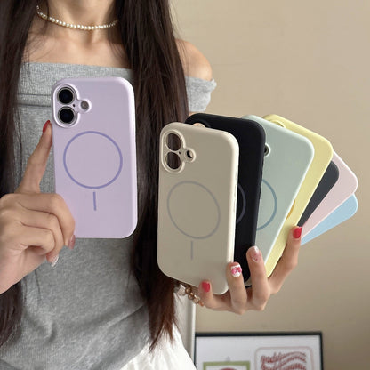 Person holding multiple phone cases in various colors