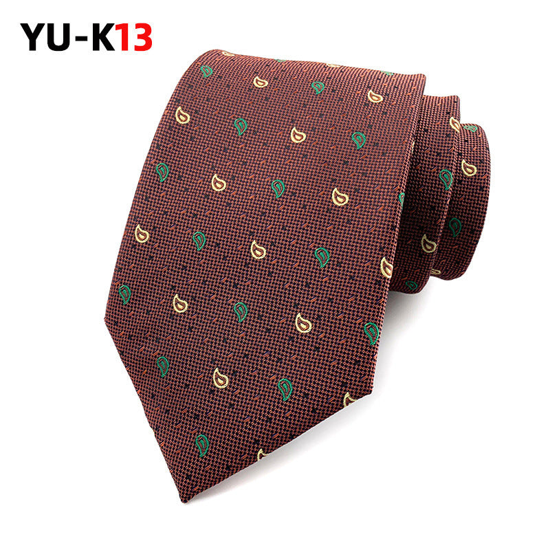 Brown patterned tie on a white background with 'YU-K13' branding.