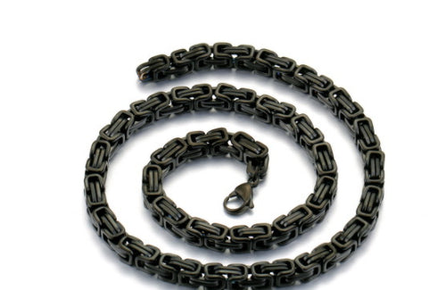 Black chain leash on a white background