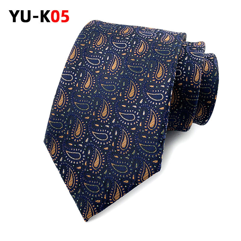 Navy blue tie with orange paisley pattern on a white background