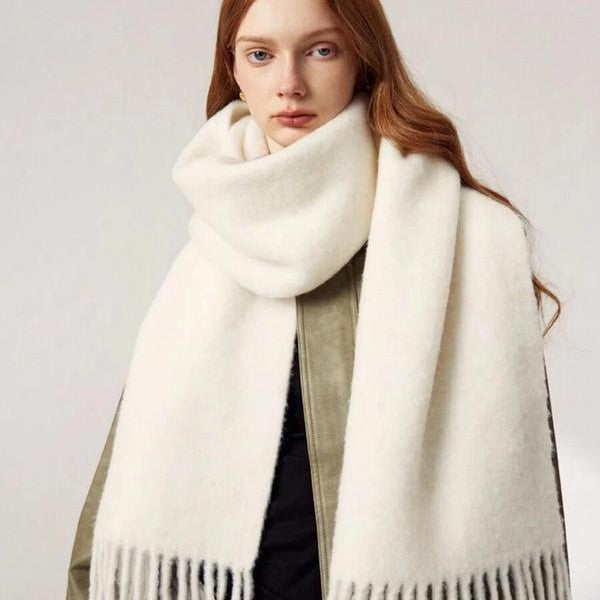 Women's wool-like scarf, white, fringed ends, draped over shoulders in a soft loop