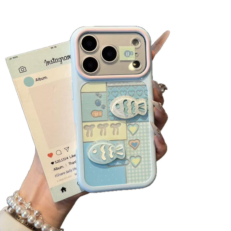 Pale blue iPhone case with hearts, checkered blocks, and raised 3D fish front